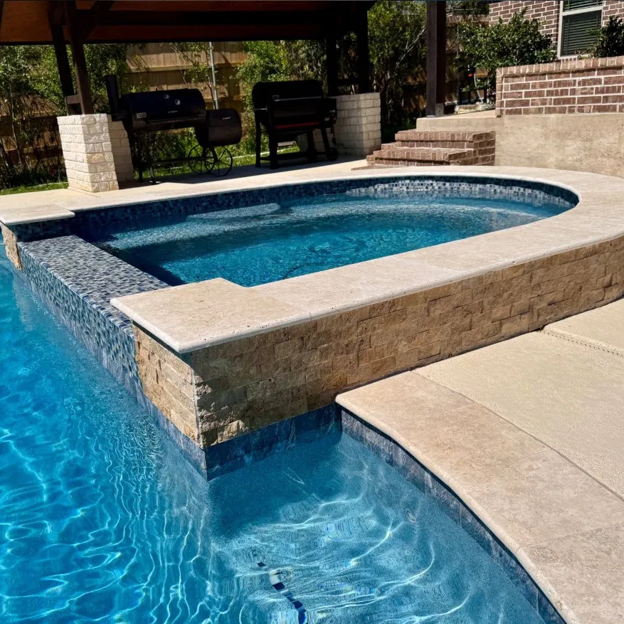 Elevated spa with stacked stone wall