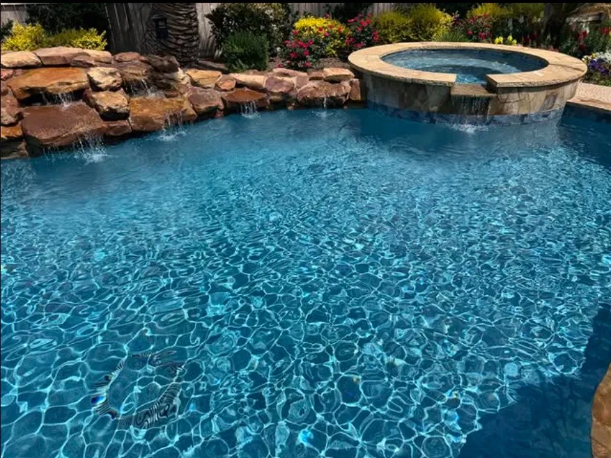 Pool with raised spa and waterfall
